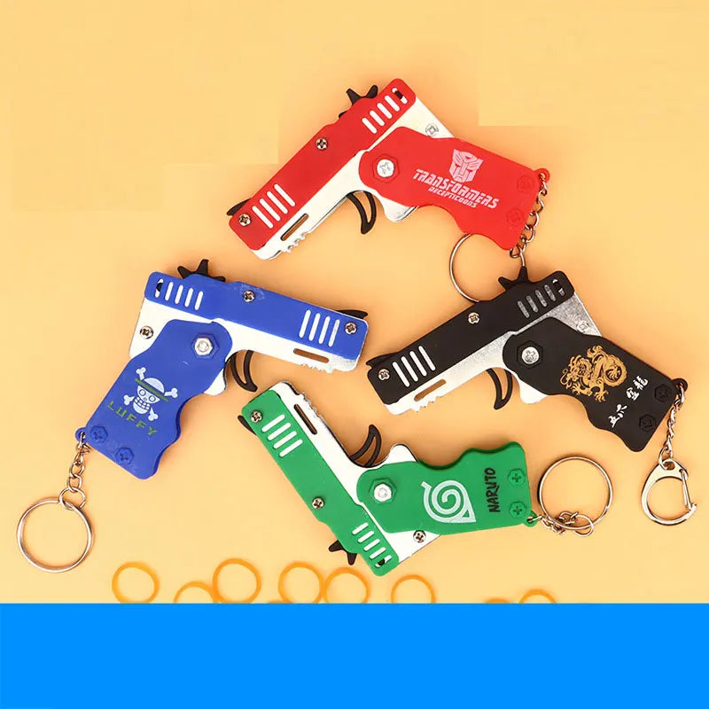 1PC MINI Toy Gun Keychain 50 Rubber Bands Folding Rubber Band Gun Shooting Pistol Alloy Key Charm Pendant Kid Outdoor Party Gift