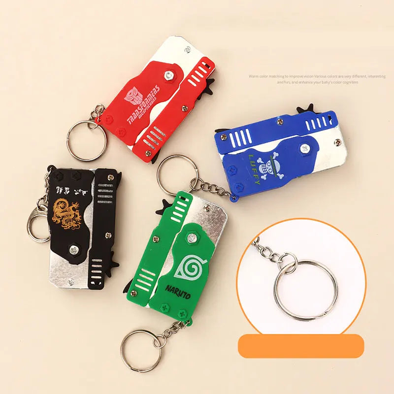 1PC MINI Toy Gun Keychain 50 Rubber Bands Folding Rubber Band Gun Shooting Pistol Alloy Key Charm Pendant Kid Outdoor Party Gift