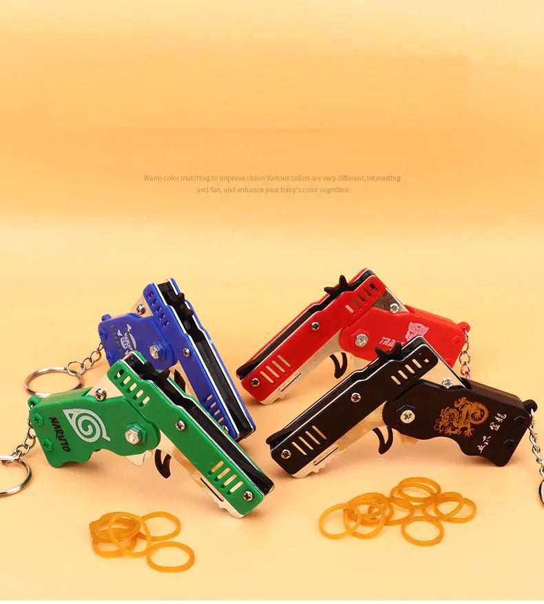 1PC MINI Toy Gun Keychain 50 Rubber Bands Folding Rubber Band Gun Shooting Pistol Alloy Key Charm Pendant Kid Outdoor Party Gift